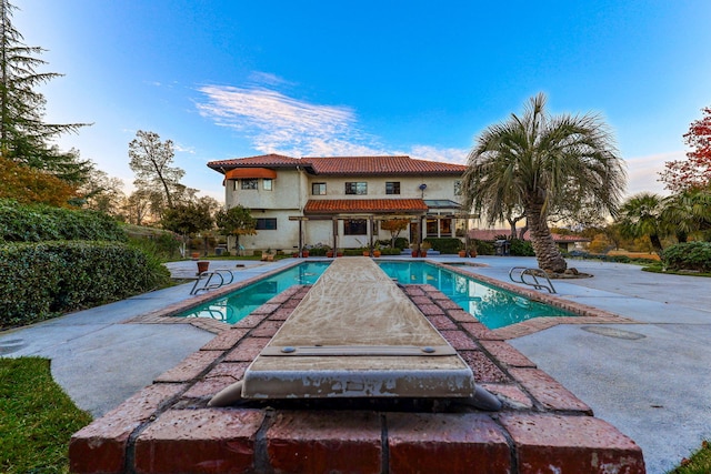 pool featuring a patio area