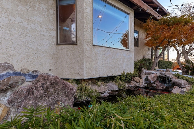 view of property exterior with stucco siding