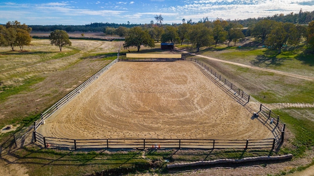 birds eye view of property with a rural view