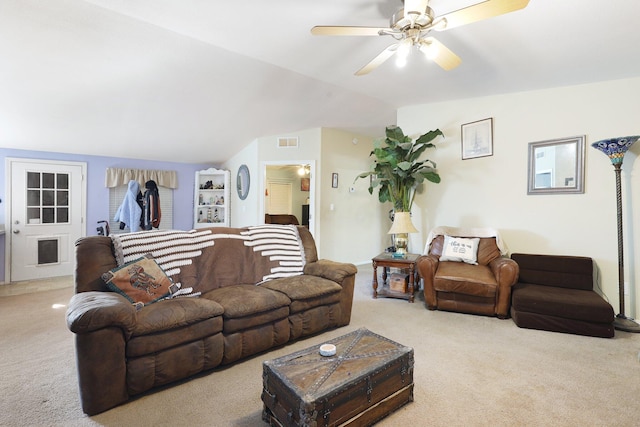 carpeted living room with ceiling fan, visible vents, and vaulted ceiling