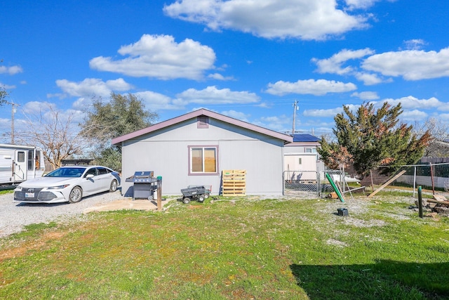 view of outbuilding with fence