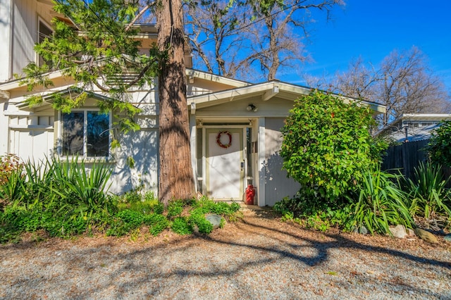 view of front of house featuring fence