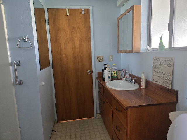 bathroom with vanity and tile patterned floors