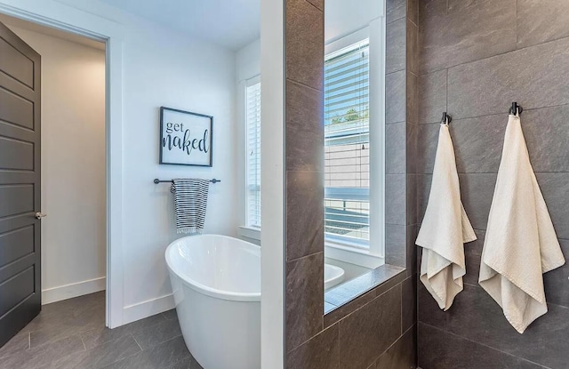 10156 Victoria Dr, Redding, CA 96001 - bathroom featuring tile patterned flooring, baseboards, and a freestanding bath