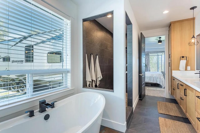 10156 Victoria Dr, Redding, CA 96001 - bathroom with baseboards, a soaking tub, ensuite bath, vanity, and recessed lighting