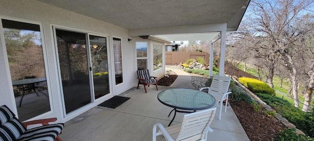 view of patio / terrace with fence