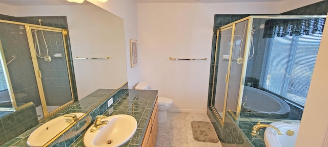 full bath featuring baseboards, toilet, vanity, a shower stall, and a bath