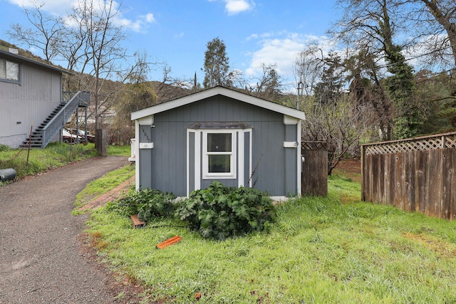 14839 Lamoine Dr, Redding, CA 96003 - view of shed with stairs, aphalt driveway, and fence