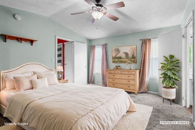 14839 Lamoine Dr, Redding, CA 96003 - carpeted bedroom featuring lofted ceiling, a ceiling fan, and a textured ceiling