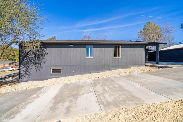 view of home's exterior with driveway