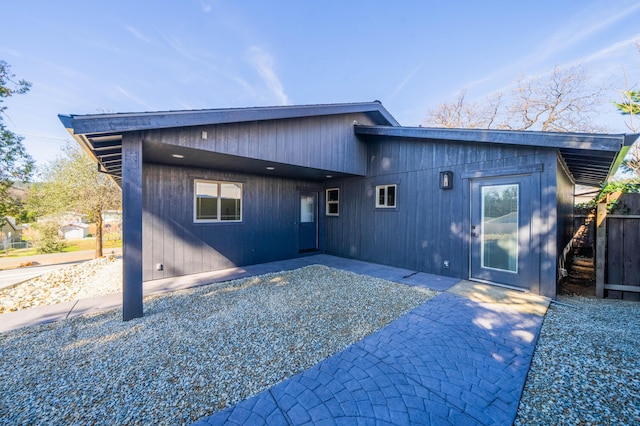 view of front facade featuring a carport and a patio