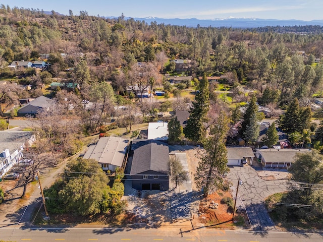 bird's eye view featuring a mountain view and a view of trees