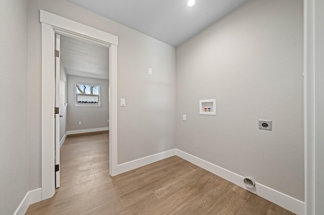 laundry area with hookup for a washing machine, laundry area, baseboards, light wood-style floors, and electric dryer hookup