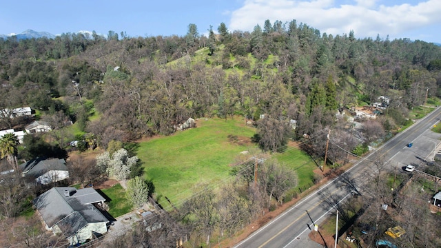 aerial view featuring a view of trees