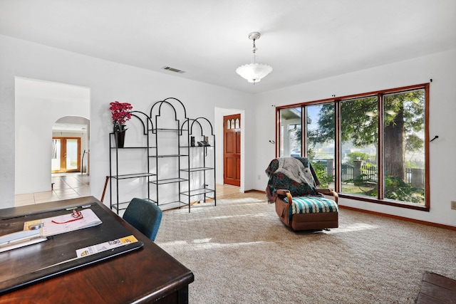 office space with visible vents, carpet floors, baseboards, arched walkways, and french doors