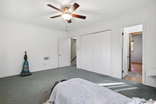 bedroom featuring crown molding, carpet flooring, and visible vents