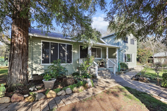 view of front of property featuring covered porch