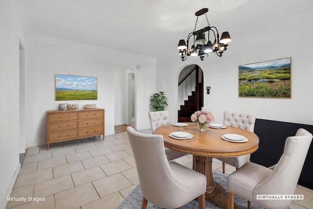 dining room with arched walkways, an inviting chandelier, light tile patterned floors, baseboards, and stairs