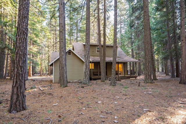 rustic home with a shingled roof