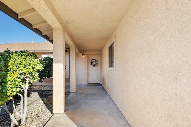 property entrance featuring stucco siding