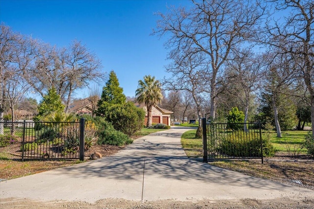 view of gate with fence