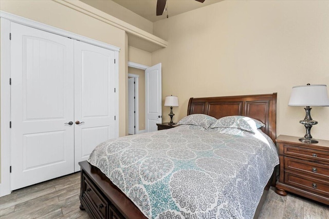 bedroom featuring a closet, ceiling fan, and wood finished floors