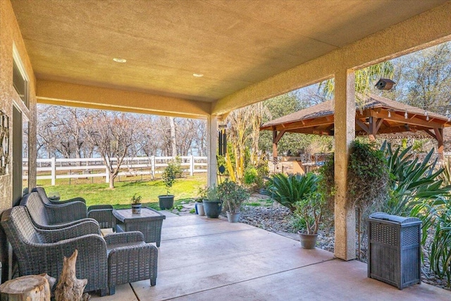 view of patio / terrace featuring a gazebo and fence