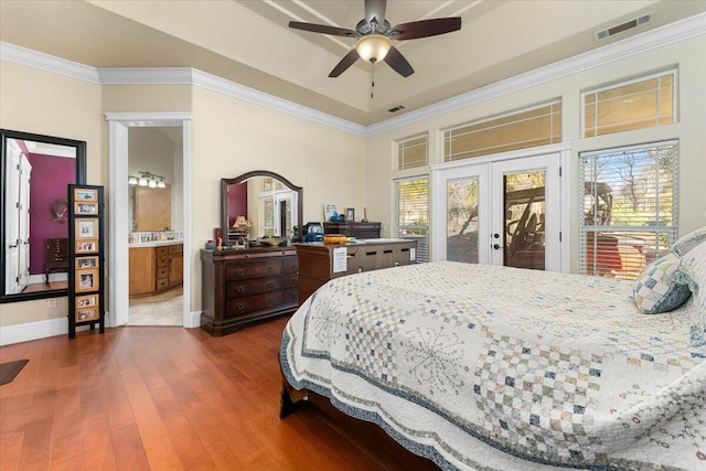 bedroom featuring access to exterior, french doors, dark wood-style flooring, visible vents, and ornamental molding