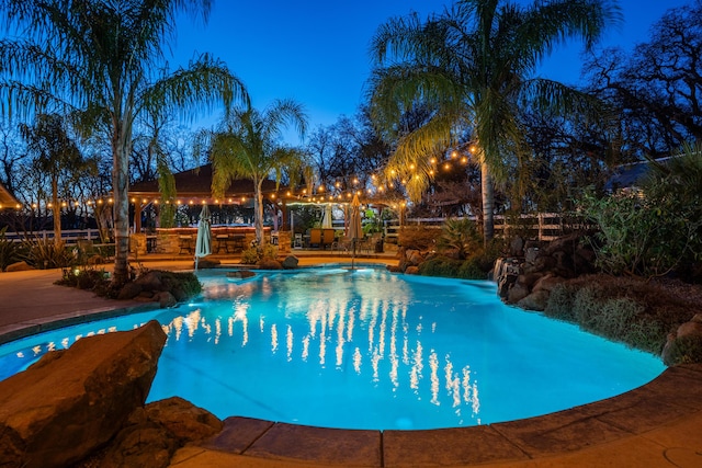 pool featuring an in ground hot tub