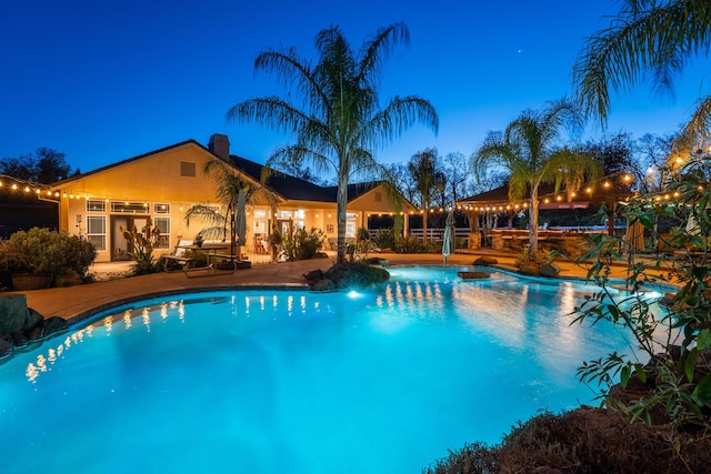 pool featuring a patio area