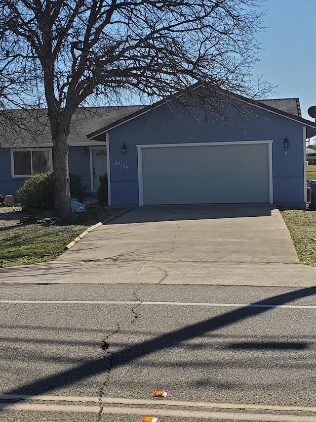 view of front of property featuring driveway and an attached garage