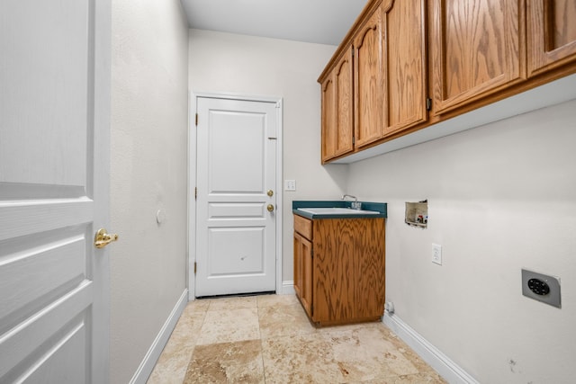 clothes washing area with hookup for a washing machine, baseboards, cabinet space, and electric dryer hookup