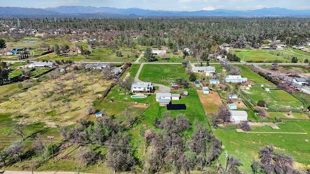 aerial view featuring a mountain view and a wooded view