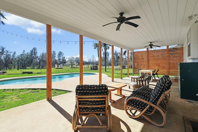 view of patio featuring a ceiling fan and an outdoor pool