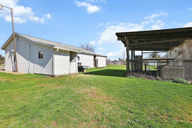 view of yard with an outdoor structure