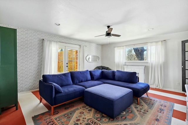 living room featuring wallpapered walls, baseboards, ceiling fan, french doors, and recessed lighting