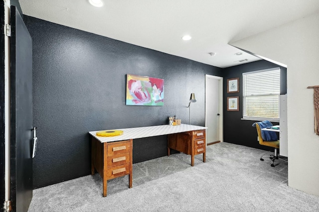 office space featuring a textured wall, carpet flooring, and recessed lighting