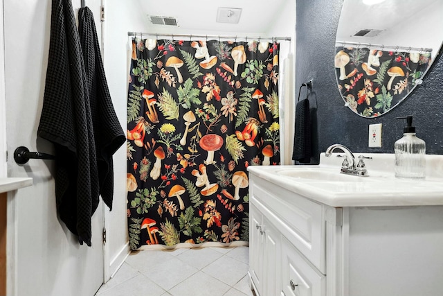 full bathroom featuring vanity, tile patterned flooring, and visible vents