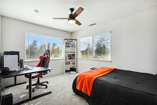 bedroom featuring ceiling fan, visible vents, and carpet flooring