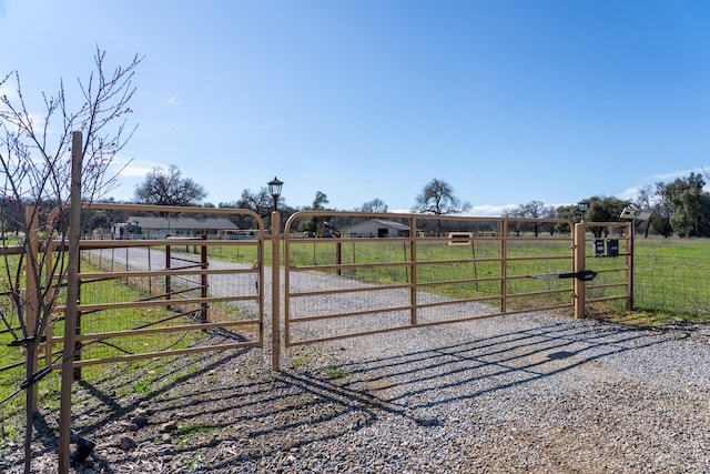 view of gate featuring a rural view