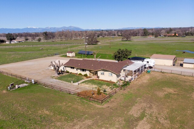 birds eye view of property with a rural view and a mountain view