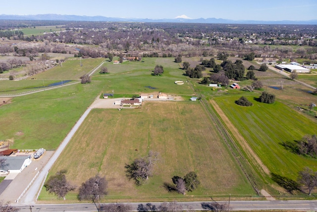 drone / aerial view featuring a rural view and a mountain view