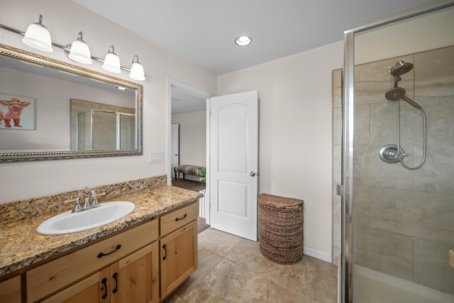 bathroom featuring vanity and a shower stall