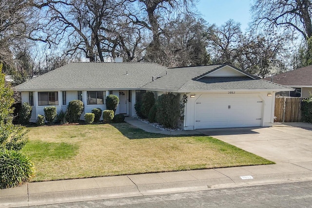 ranch-style home with an attached garage, fence, driveway, stucco siding, and a front lawn