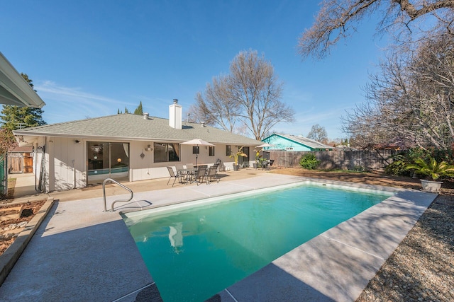 view of pool with a patio area, a fenced backyard, and a fenced in pool