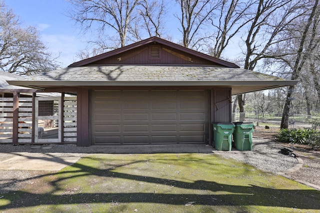 garage with fence