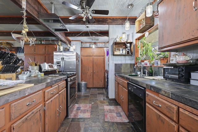 kitchen with brown cabinets, stainless steel appliances, dark countertops, stone finish flooring, and a sink