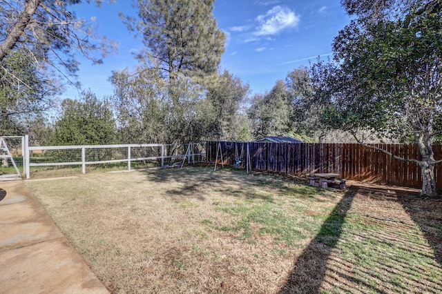 view of yard with a fenced backyard