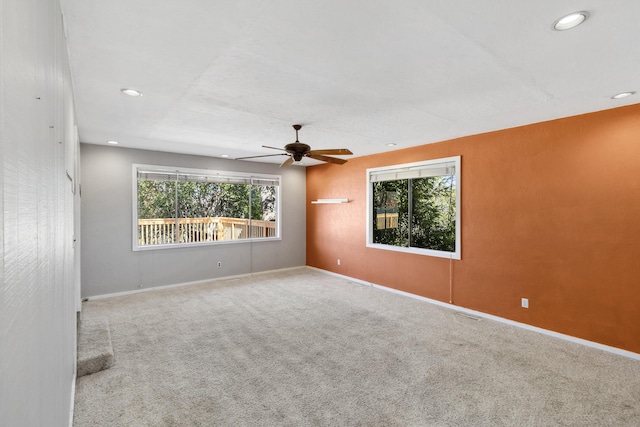 empty room featuring a ceiling fan, carpet, baseboards, and recessed lighting