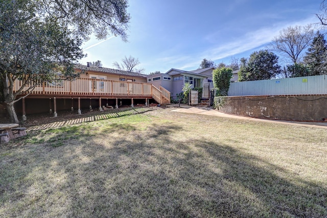 view of yard featuring a deck and fence